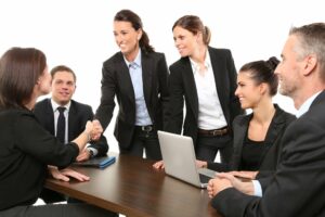 Well dressed meeting at a wooden table